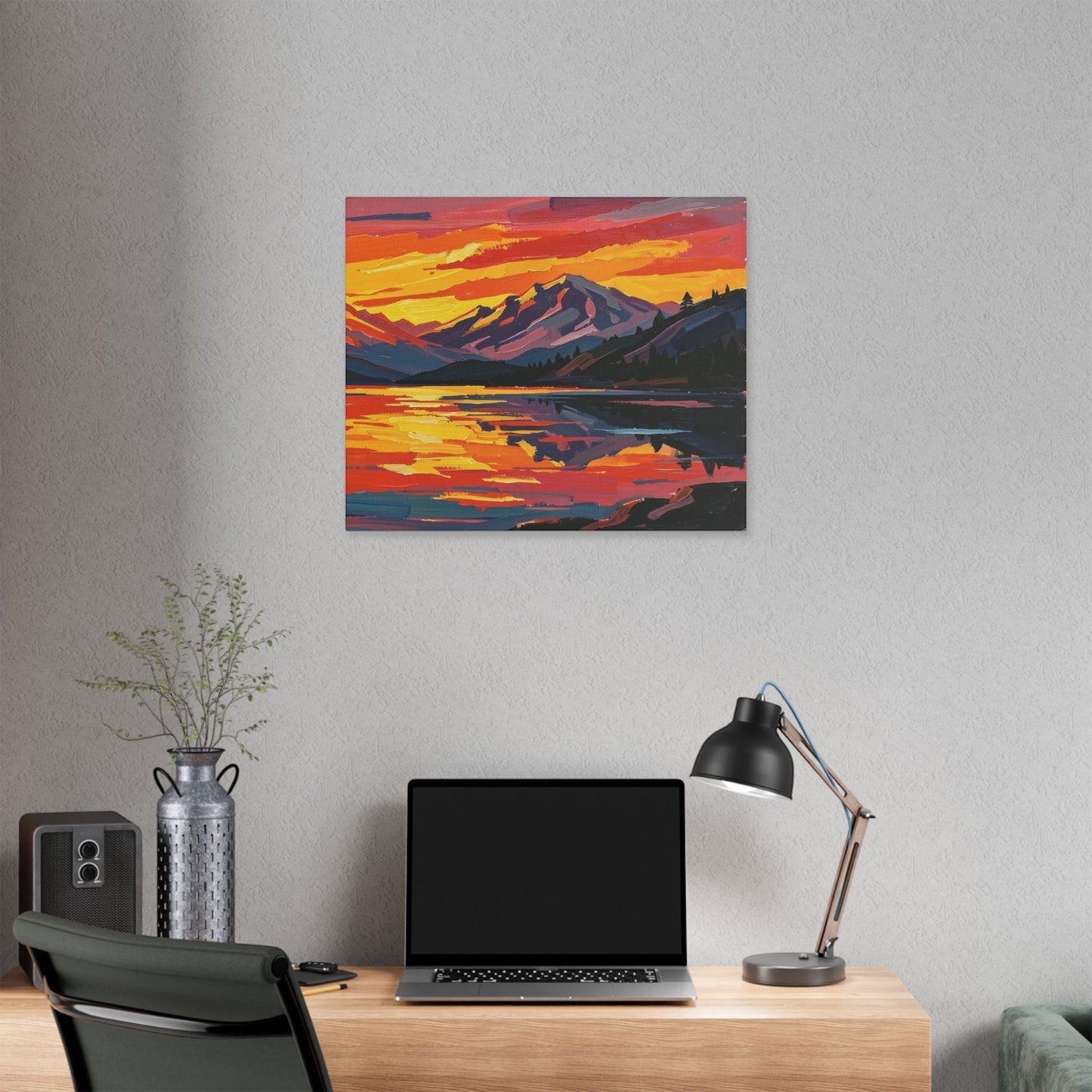 Chromatic canvas print of a vibrant sunset over a mountain lake with orange and indigo brushstrokes on a grey wall.