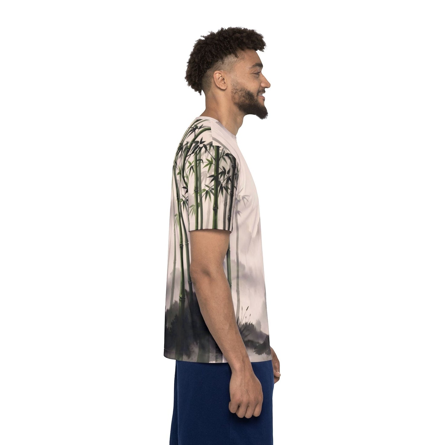 Man wearing a Chromatic Bamboo Mist sports jersey with a green and charcoal zen bamboo grove print on polyester.