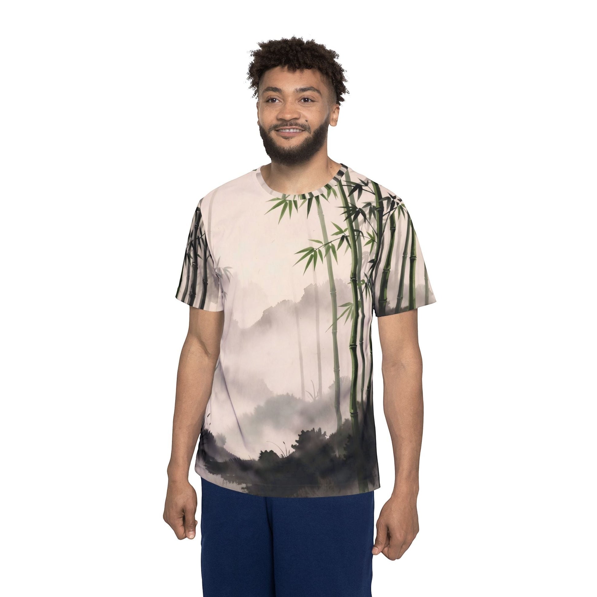 A man wearing a Chromatic Bamboo Mist sports jersey with a green and charcoal zen landscape print on polyester.