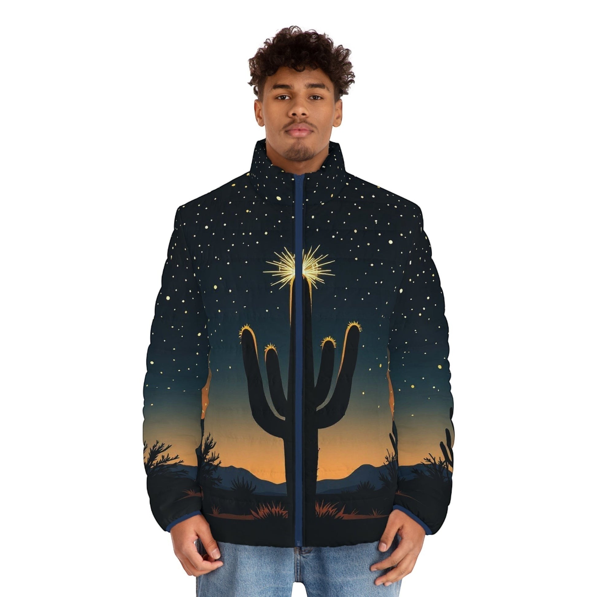 A man wearing a Chromatic puffer jacket featuring a desert cactus silhouette under a starry night sky print.