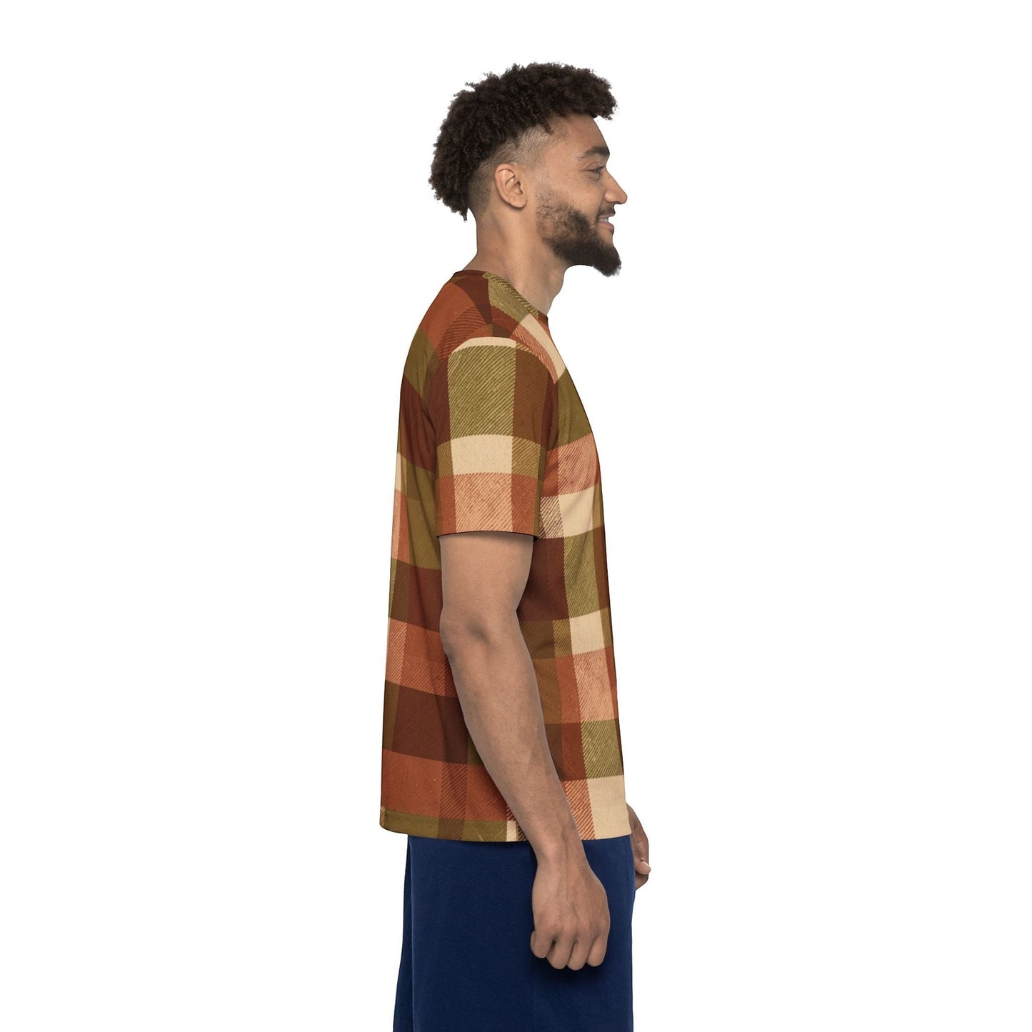 Chromatic sports jersey in autumn brown plaid with rust, olive, and cream tones, worn by a smiling man in profile.