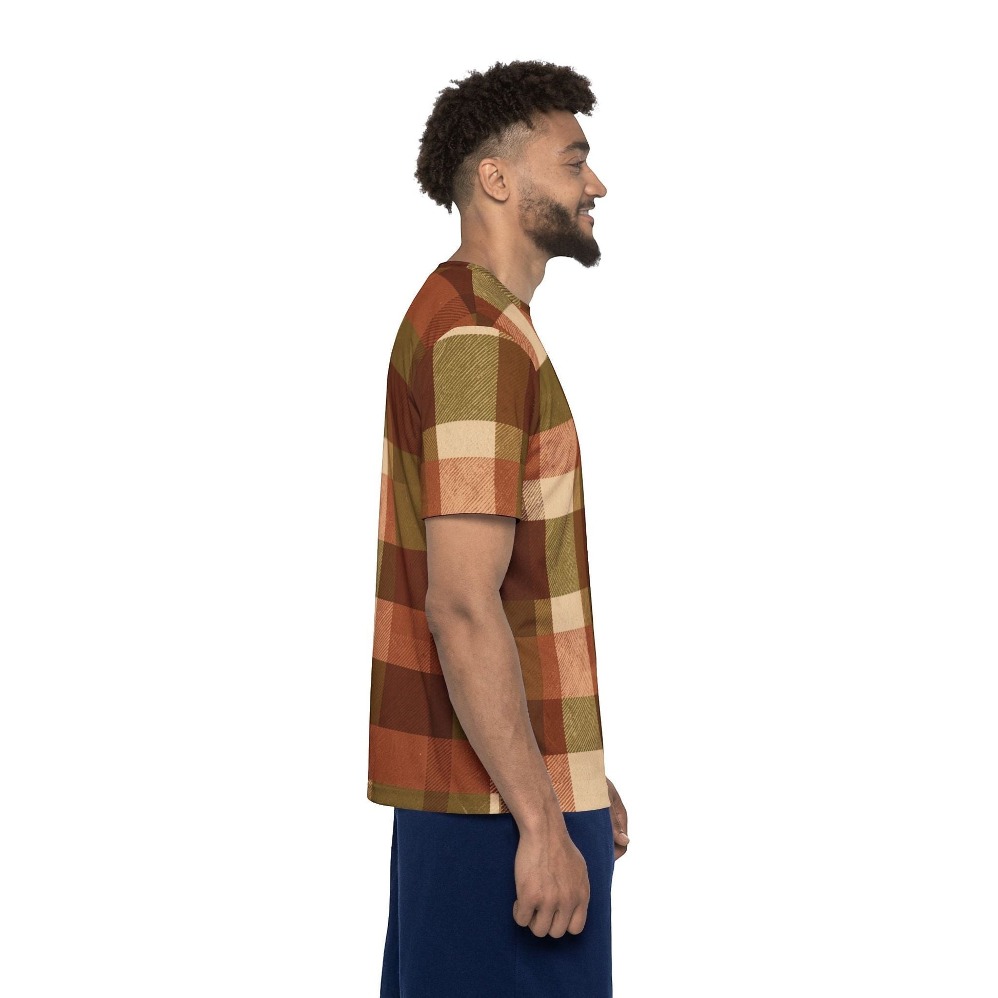 Chromatic sports jersey in autumn brown plaid with rust, olive, and cream tones, worn by a smiling man in profile.