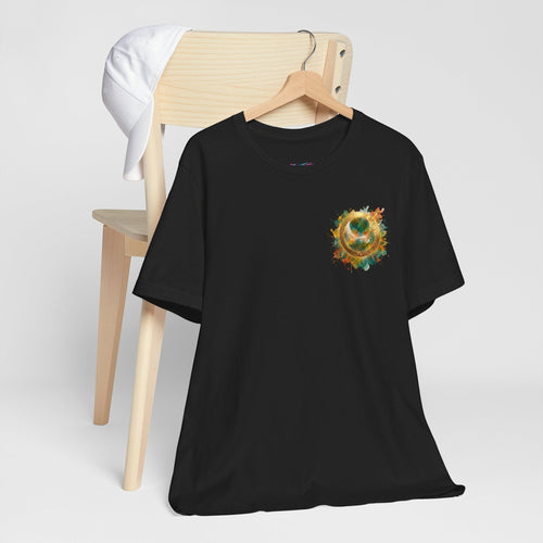 Chromatic black cotton t-shirt with a watercolor halo graphic on the chest, hanging on a wooden chair.