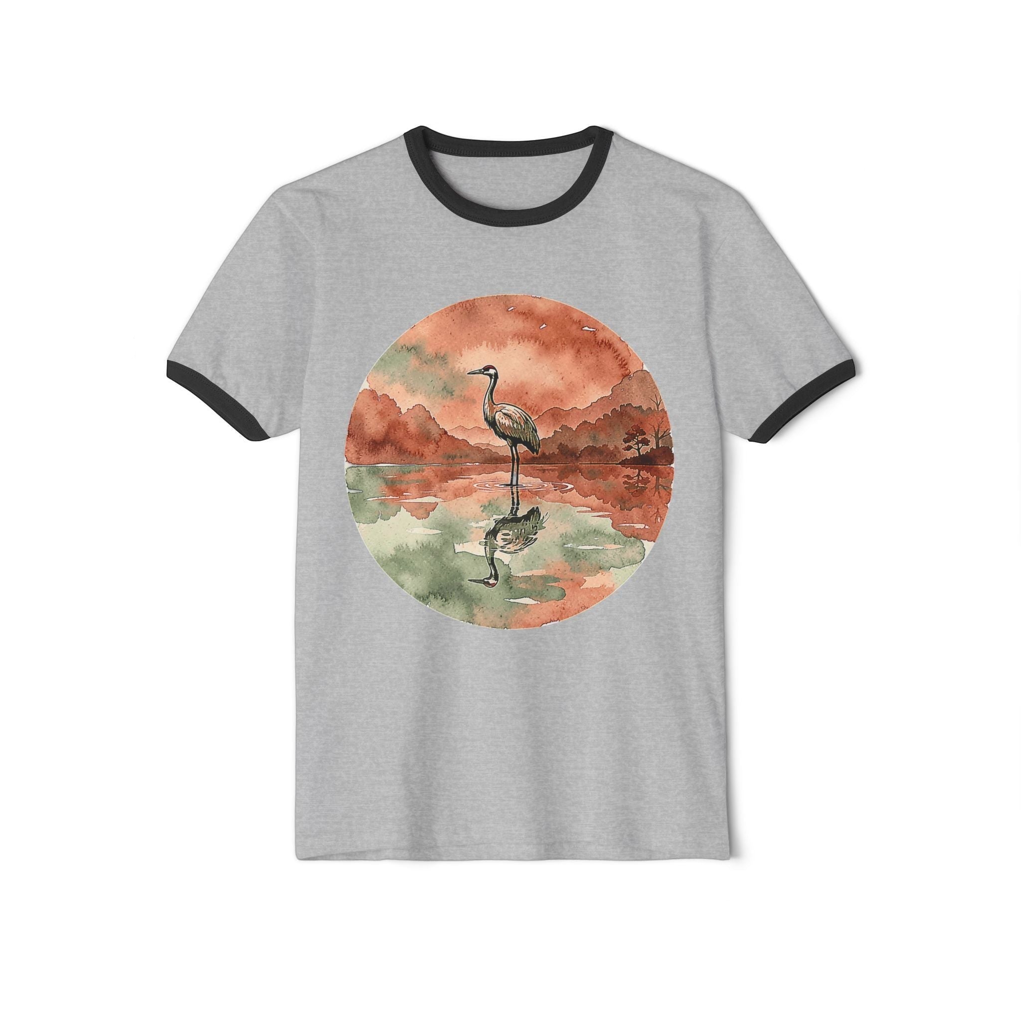 Chromatic grey ringer t-shirt with a circular watercolor print of a lone crane reflecting in a pond.